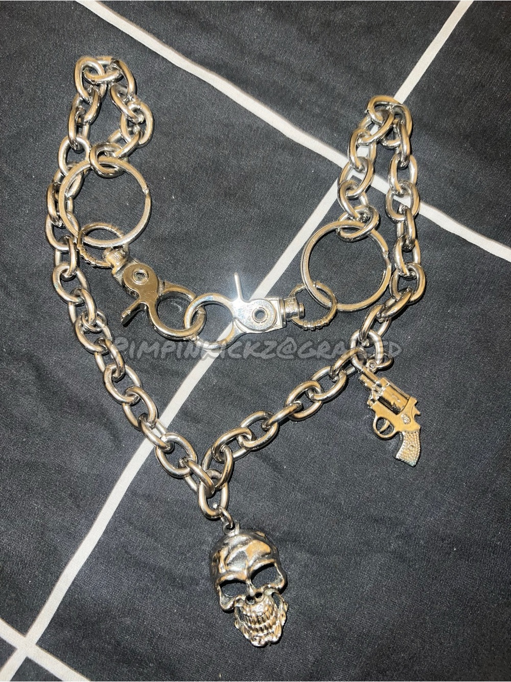 Silver skull head/gun pant chain (2007)